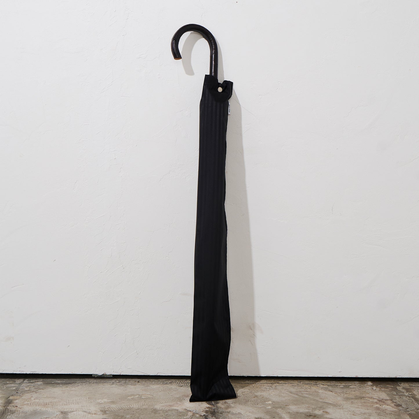 The umbrella comes  with a matching storage sleeve.