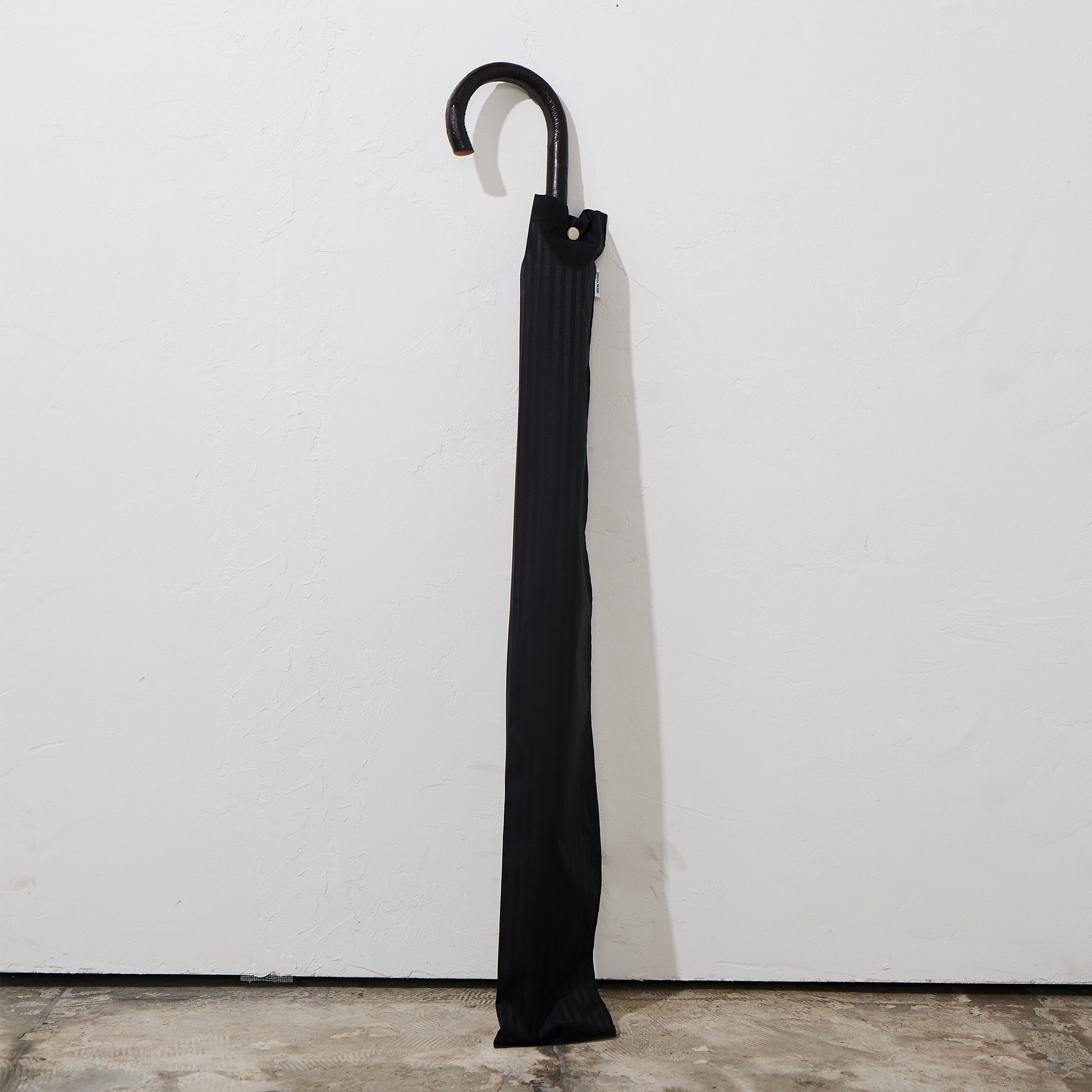 The umbrella comes  with a matching storage sleeve.
